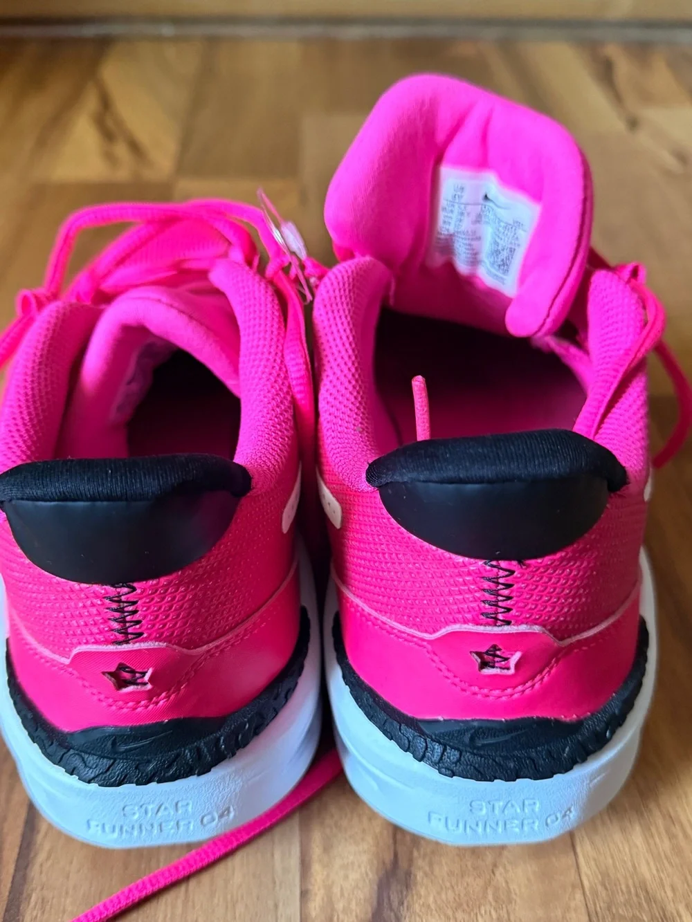 Nike Vibrant Pink Running Shoe with White Swoosh